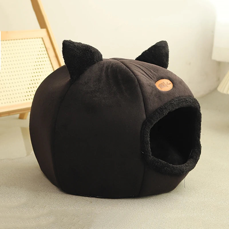 Cat resting in a cosy cave bed – photo 6