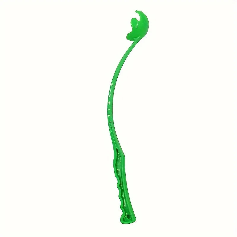 Dog ball launcher stick with a tennis ball in the park – photo 7
