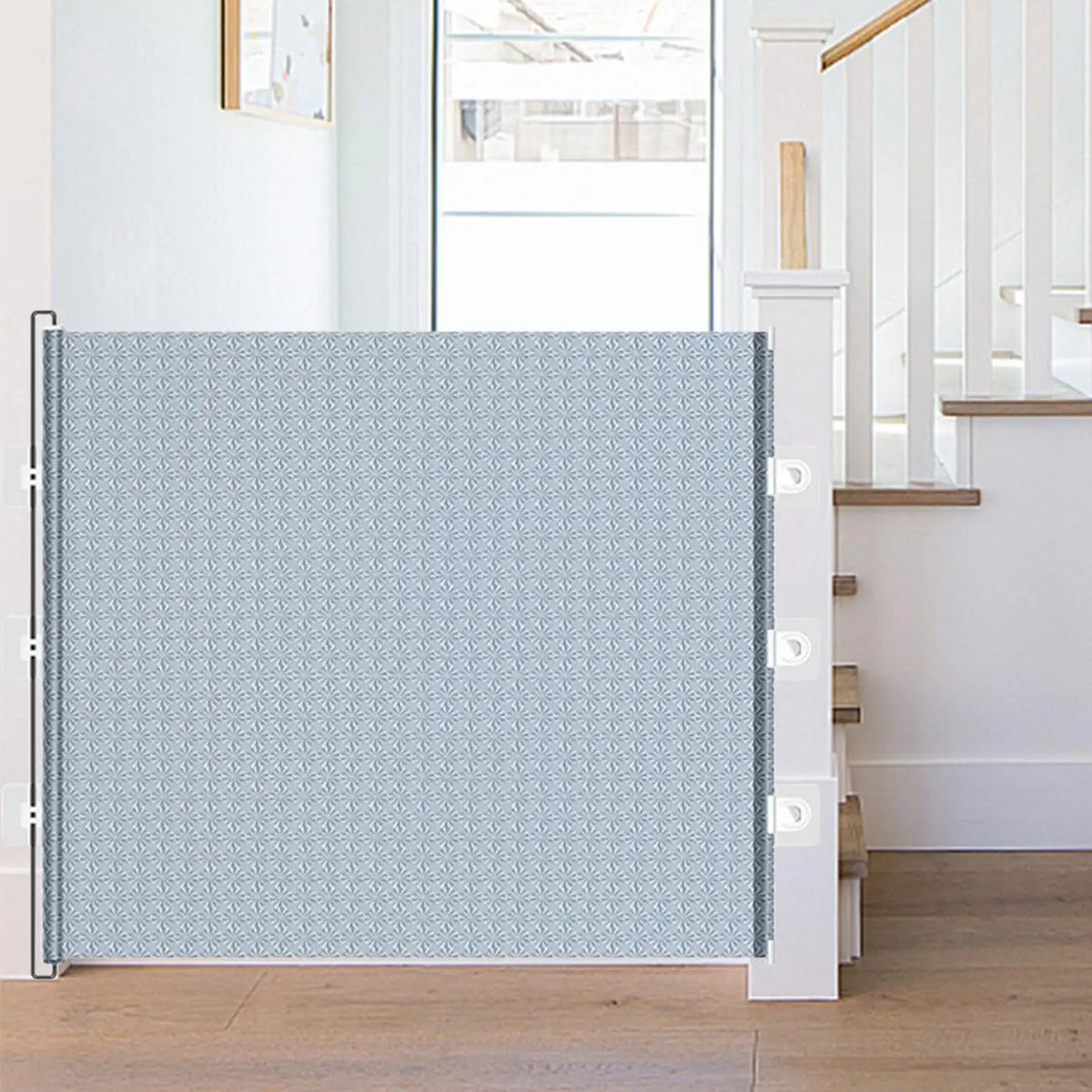 Retractable mesh pet gate across a doorway