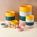 Ceramic pet bowl on a raised bamboo stand