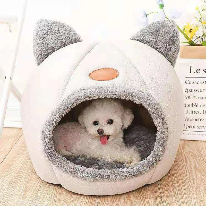 Cat resting in a cosy cave bed – photo 9