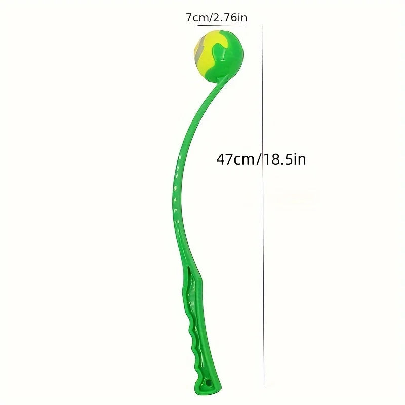 Dog ball launcher stick with a tennis ball in the park – photo 2