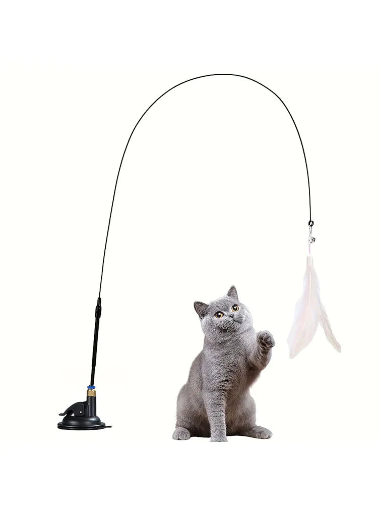 Cat playing with a feather and bell teaser wand on a suction cup – photo 7