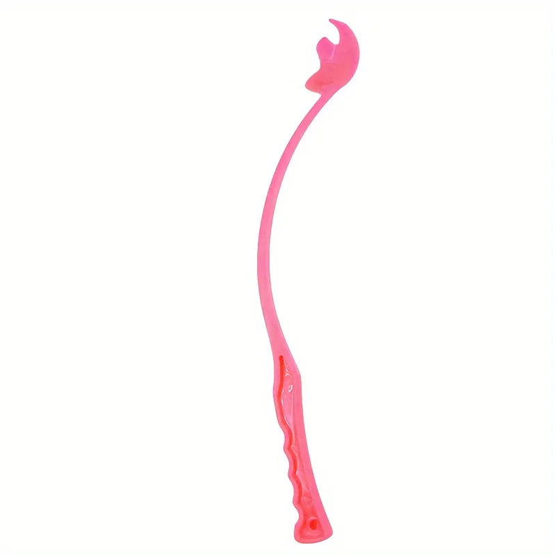 Dog ball launcher stick with a tennis ball in the park – photo 9