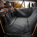 Waterproof dog hammock fitted across a car back seat
